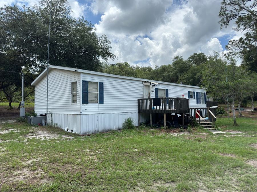 Mobile home on a wooded lot
